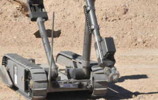 photo of irobot with tracks and arm
